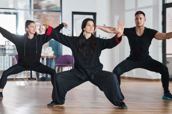 tai-chi-students-with-teacher-training-single-whip-2023-11-27-04-49-55-utc-1000x480